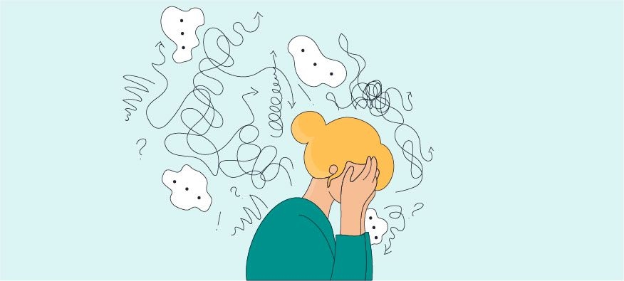 a woman is holding her hands over her eye in distress from the toxic trait of gaslighting 